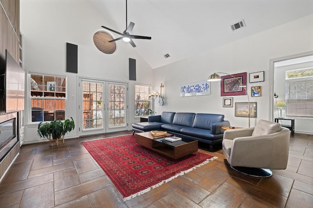 3702 Terrina St Unit 12, Austin, TX 78759 - living area with high vaulted ceiling, ceiling fan, stone tile flooring, and french doors
