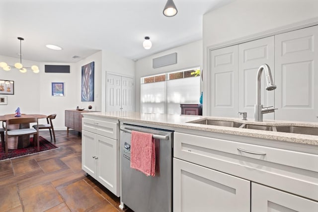 3702 Terrina St Unit 12, Austin, TX 78759 - kitchen featuring stainless steel dishwasher, white cabinets, light stone countertops, pendant lighting, and recessed lighting