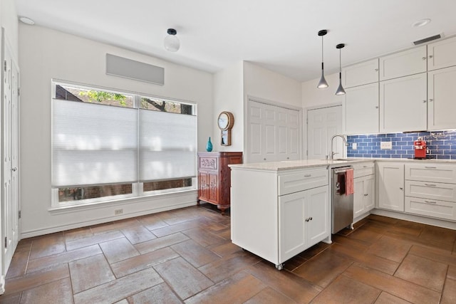 3702 Terrina St Unit 12, Austin, TX 78759 - kitchen with dishwasher, white cabinets, a peninsula, tasteful backsplash, and decorative light fixtures