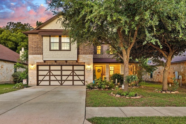 1149 Hyde Park Dr, Round Rock, TX 78665 - view of front facade featuring stone siding, driveway, and a garage