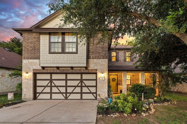 1149 Hyde Park Dr, Round Rock, TX 78665 - view of front of house featuring stone siding, driveway, and an attached garage