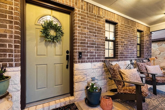 1149 Hyde Park Dr, Round Rock, TX 78665 - doorway to property featuring a porch and brick siding