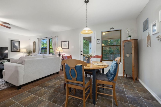 1149 Hyde Park Dr, Round Rock, TX 78665 - dining area with ceiling fan and dark stone finish floors