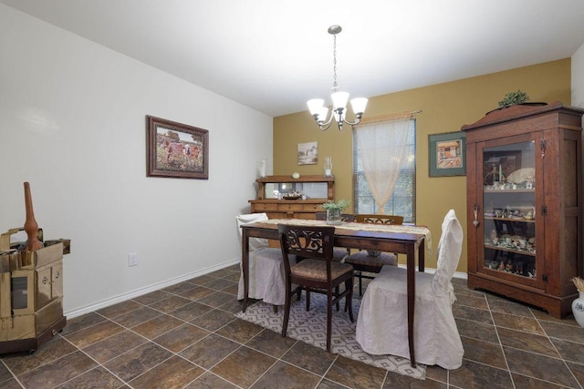 1149 Hyde Park Dr, Round Rock, TX 78665 - dining room with a chandelier and dark stone finish floors