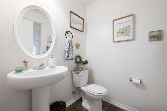 1149 Hyde Park Dr, Round Rock, TX 78665 - bathroom featuring baseboards and tile patterned flooring
