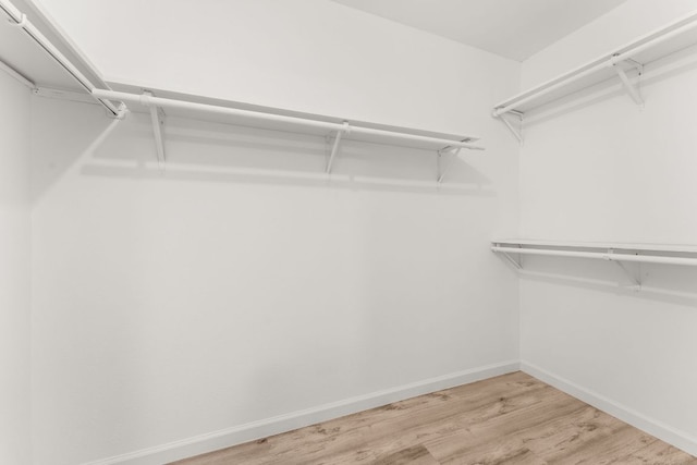 903 Silver Quail Ln, Austin, TX 78758 - walk in closet featuring wood finished floors