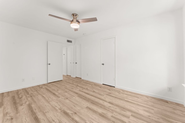 903 Silver Quail Ln, Austin, TX 78758 - unfurnished bedroom with light wood-style flooring and a ceiling fan