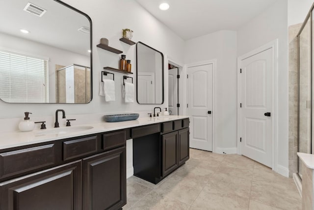 841 Expedition Way, Round Rock, TX 78665 - full bath with a shower stall, double vanity, recessed lighting, and tile patterned flooring
