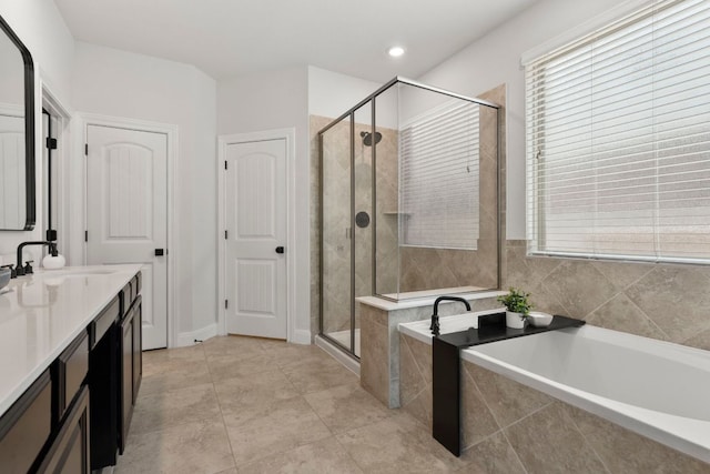 841 Expedition Way, Round Rock, TX 78665 - full bath featuring a bath, a shower stall, vanity, healthy amount of natural light, and recessed lighting