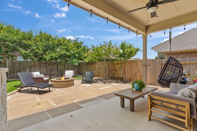 841 Expedition Way, Round Rock, TX 78665 - fenced backyard featuring a patio area, ceiling fan, and an outdoor living space with a fire pit