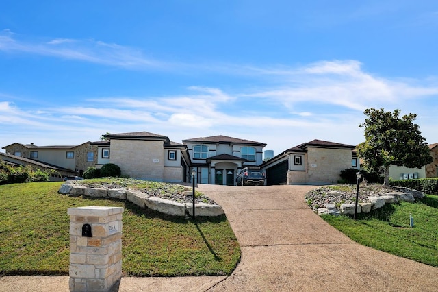1213 Delsie Dr Unit A, Austin, TX 78734 - view of front of house featuring stone siding, concrete driveway, a front yard, an attached garage, and a residential view