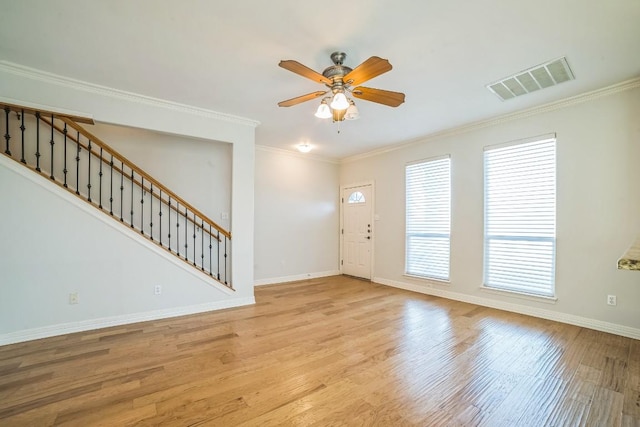 1213 Delsie Dr Unit A, Austin, TX 78734 - foyer with a ceiling fan, wood finished floors, stairway, and ornamental molding