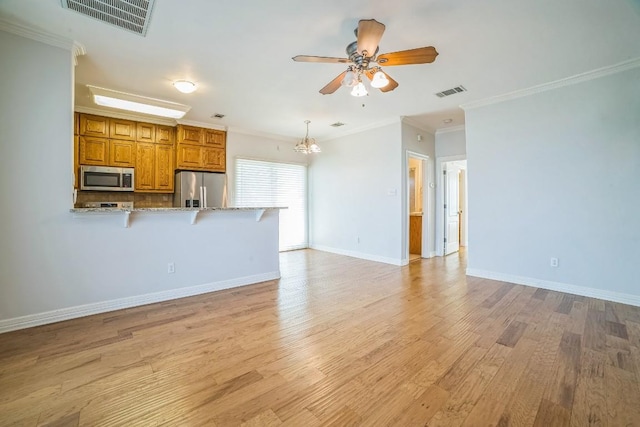 1213 Delsie Dr Unit A, Austin, TX 78734 - unfurnished living room featuring light wood-style floors, a ceiling fan, ornamental molding, and a chandelier