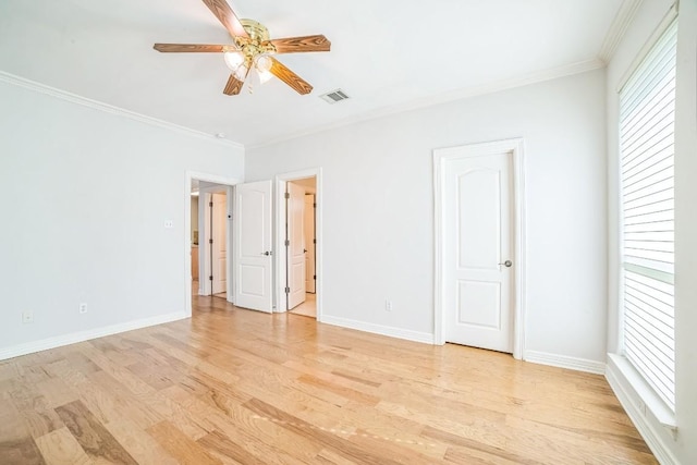1213 Delsie Dr Unit A, Austin, TX 78734 - unfurnished bedroom with light wood finished floors, multiple windows, crown molding, and ceiling fan