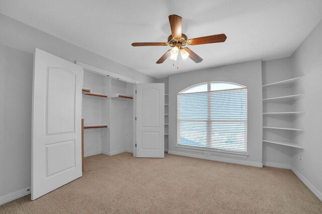 1213 Delsie Dr Unit A, Austin, TX 78734 - unfurnished bedroom featuring light colored carpet, a closet, and a ceiling fan