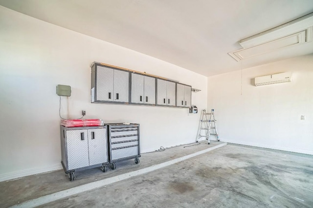 1213 Delsie Dr Unit A, Austin, TX 78734 - garage featuring a wall mounted AC and baseboards
