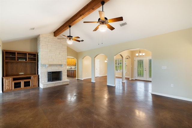 10565 N 77th Hwy, Lexington, TX 78947 - unfurnished living room with arched walkways, finished concrete floors, a fireplace, and ceiling fan
