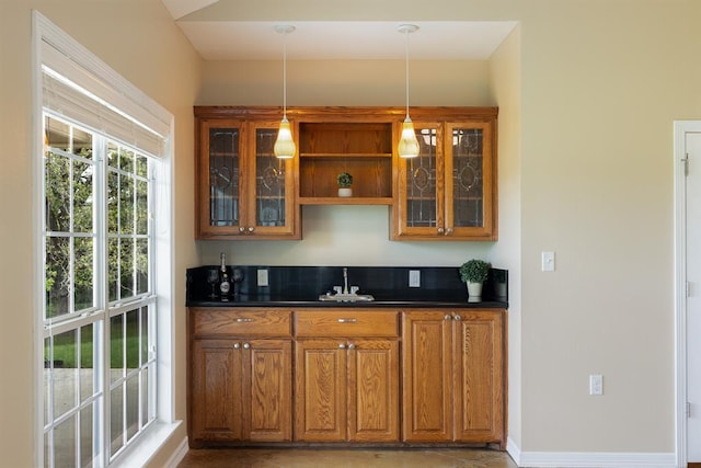 10565 N 77th Hwy, Lexington, TX 78947 - indoor wet bar featuring decorative light fixtures and light tile patterned floors