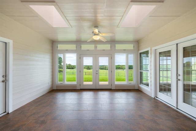 10565 N 77th Hwy, Lexington, TX 78947 - unfurnished sunroom with french doors, a skylight, and wooden walls