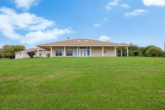 10565 N 77th Hwy, Lexington, TX 78947 - rear view of property with a yard and a chimney