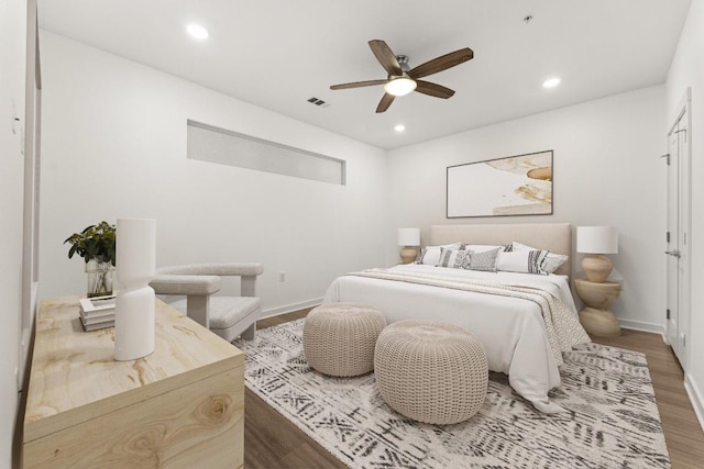 4361 S Congress Ave Unit 514, Austin, TX 78745 - bedroom featuring wood finished floors, recessed lighting, and a ceiling fan
