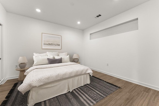 4361 S Congress Ave Unit 514, Austin, TX 78745 - bedroom with wood finished floors and recessed lighting
