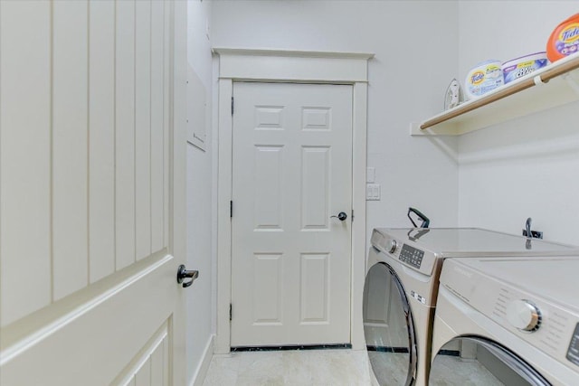 6608 Lantern View Dr Unit 102, Jonestown, TX 78645 - laundry room with washing machine and dryer and baseboards