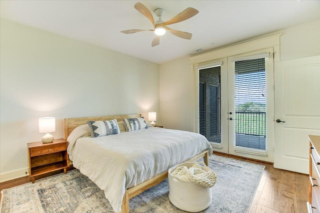 6608 Lantern View Dr Unit 102, Jonestown, TX 78645 - bedroom featuring access to exterior, light wood-style floors, and a ceiling fan