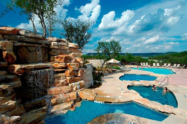 6608 Lantern View Dr Unit 102, Jonestown, TX 78645 - community pool with a patio area