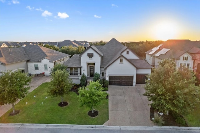 131 Katie Dr, Austin, TX 78737 - view of front of home featuring a residential view, a garage, driveway, and a front lawn