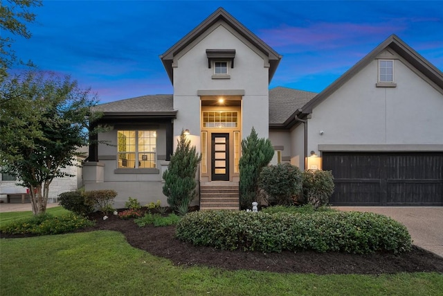 131 Katie Dr, Austin, TX 78737 - view of front of house featuring stucco siding, an attached garage, concrete driveway, and roof with shingles