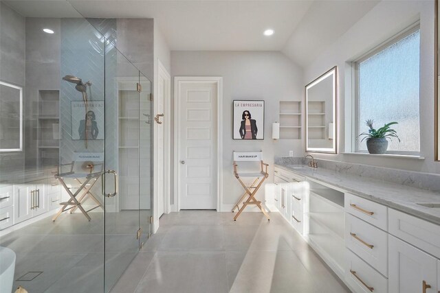 131 Katie Dr, Austin, TX 78737 - full bath with a shower stall, double vanity, tile patterned flooring, recessed lighting, and vaulted ceiling