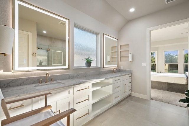 131 Katie Dr, Austin, TX 78737 - bathroom featuring double vanity, a shower stall, recessed lighting, tile patterned floors, and lofted ceiling