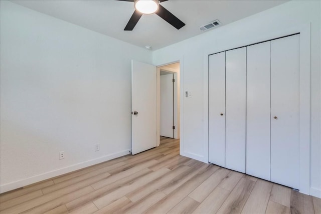 11202 Alhambra Dr, Austin, TX 78759 - unfurnished bedroom with light wood-type flooring, a closet, and a ceiling fan