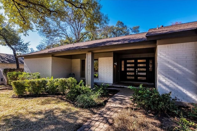 11202 Alhambra Dr, Austin, TX 78759 - doorway to property with brick siding
