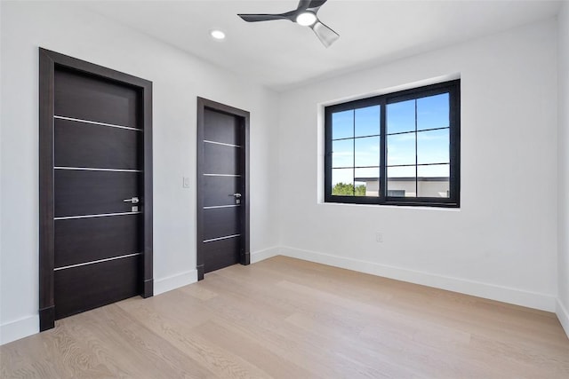 3206 Marshall Ave, Lago Vista, TX 78645 - unfurnished bedroom featuring light wood-style floors, ceiling fan, and recessed lighting