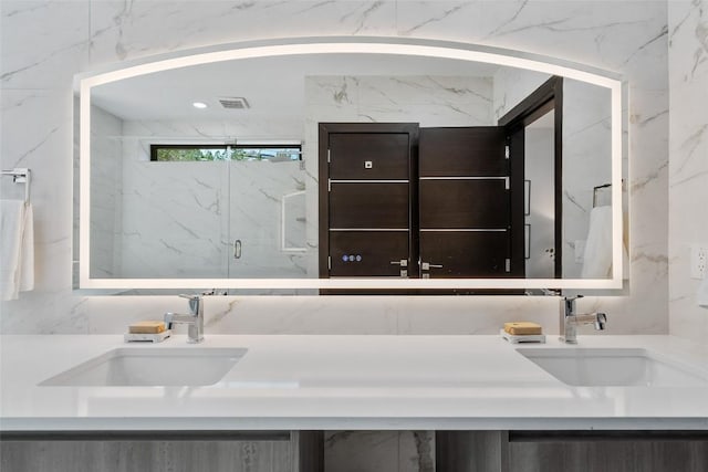 3206 Marshall Ave, Lago Vista, TX 78645 - full bathroom featuring double vanity and a marble finish shower