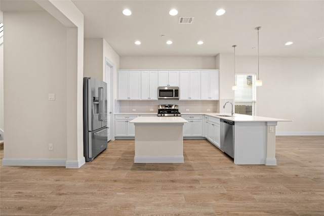 600 C-Bar Ranch Trl Unit 108, Cedar Park, TX 78613 - kitchen featuring stainless steel appliances, decorative backsplash, a peninsula, white cabinets, and recessed lighting