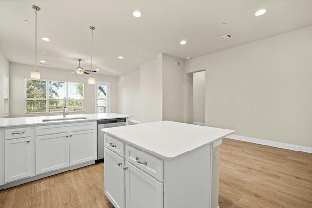 600 C-Bar Ranch Trl Unit 108, Cedar Park, TX 78613 - kitchen featuring stainless steel dishwasher, a kitchen island, light wood-style flooring, light countertops, and recessed lighting