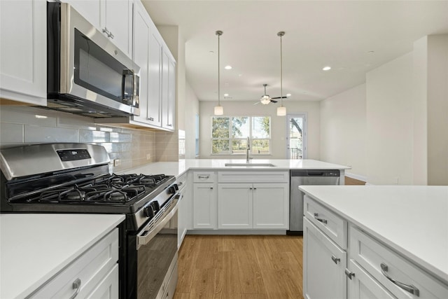 600 C-Bar Ranch Trl Unit 108, Cedar Park, TX 78613 - kitchen with stainless steel appliances, light wood-type flooring, light countertops, backsplash, and a ceiling fan