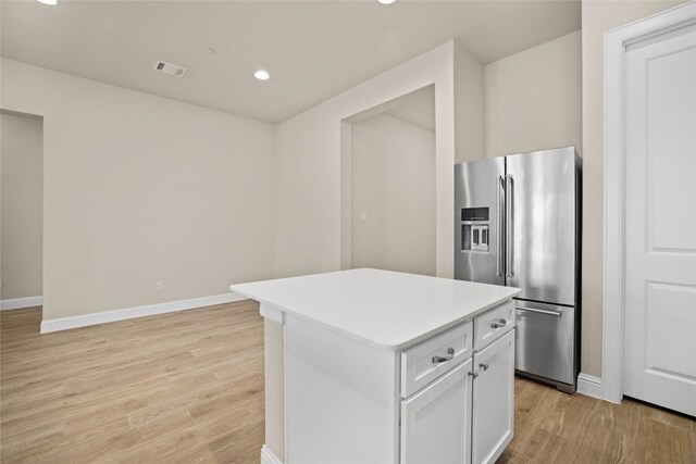 600 C-Bar Ranch Trl Unit 108, Cedar Park, TX 78613 - kitchen with high quality fridge, light wood-style flooring, a kitchen island, light countertops, and recessed lighting