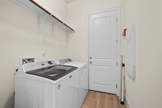 600 C-Bar Ranch Trl Unit 108, Cedar Park, TX 78613 - laundry area featuring washer and clothes dryer and light wood finished floors