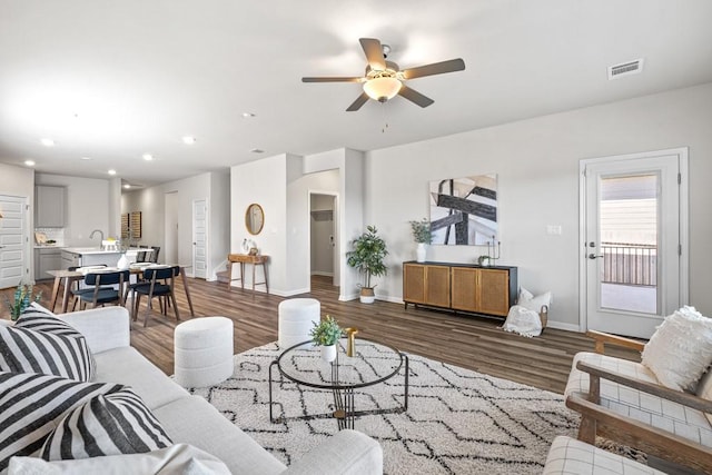 207 El Capitan Loop, Dripping Springs, TX 78620 - living room featuring a ceiling fan, wood finished floors, and recessed lighting