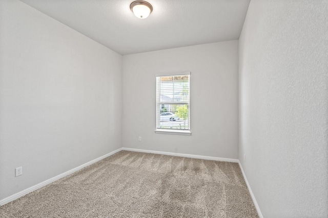 207 El Capitan Loop, Dripping Springs, TX 78620 - carpeted spare room with baseboards
