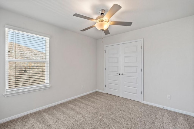 207 El Capitan Loop, Dripping Springs, TX 78620 - unfurnished bedroom featuring carpet floors, a closet, and a ceiling fan