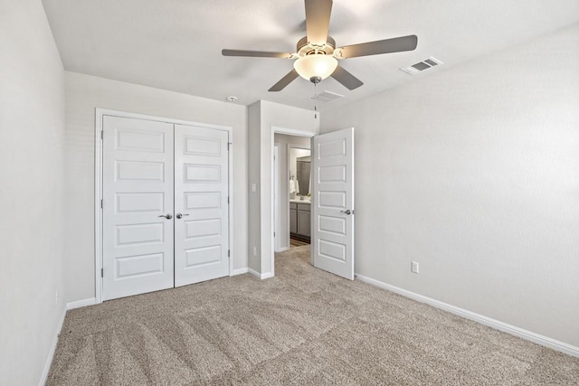 207 El Capitan Loop, Dripping Springs, TX 78620 - unfurnished bedroom featuring carpet floors, a closet, and ceiling fan