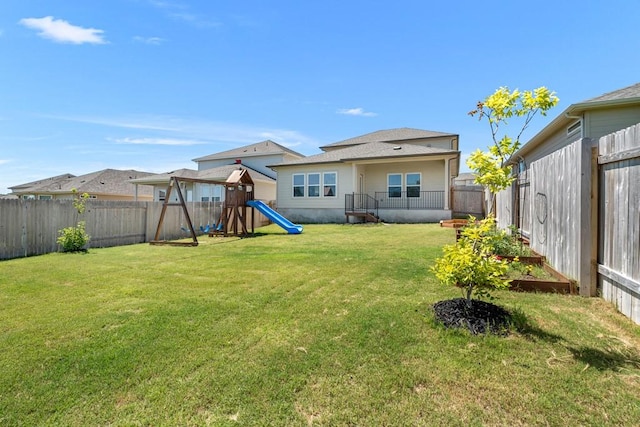 207 El Capitan Loop, Dripping Springs, TX 78620 - fenced backyard with a playground
