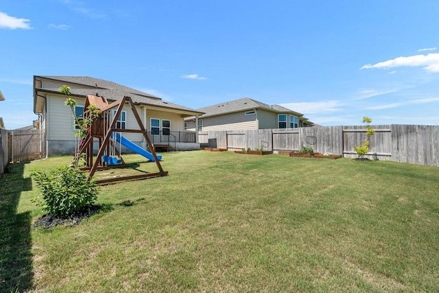 207 El Capitan Loop, Dripping Springs, TX 78620 - fenced backyard with a playground