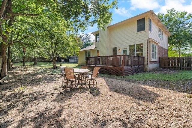 3121 Yandall Dr, Austin, TX 78748 - back of property featuring a wooden deck and outdoor dining area