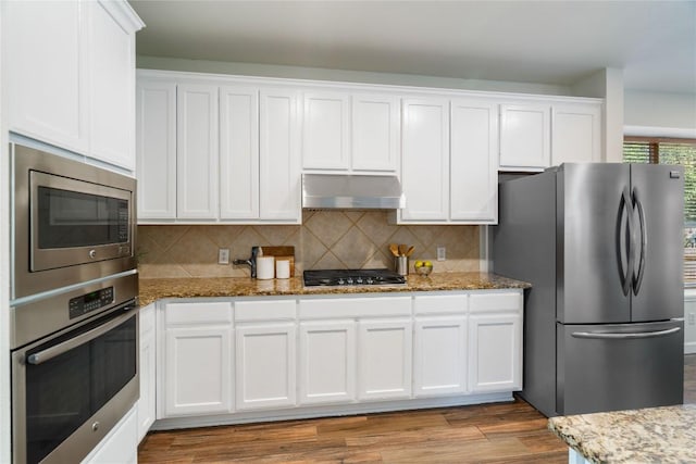 3121 Yandall Dr, Austin, TX 78748 - kitchen featuring stainless steel appliances, under cabinet range hood, and white cabinets
